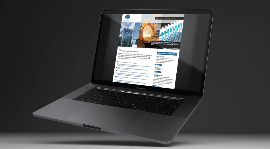 A black laptop displaying the Camden International Financing website home page.