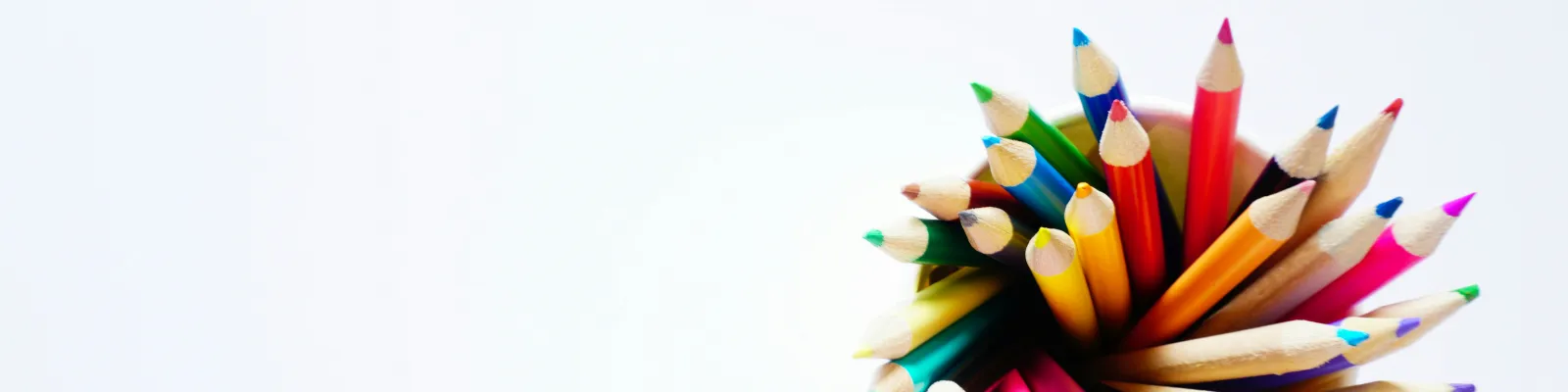 Coloured pencils in a pot