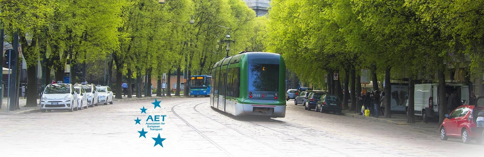 Electric Tram driving along a Milan inner city road